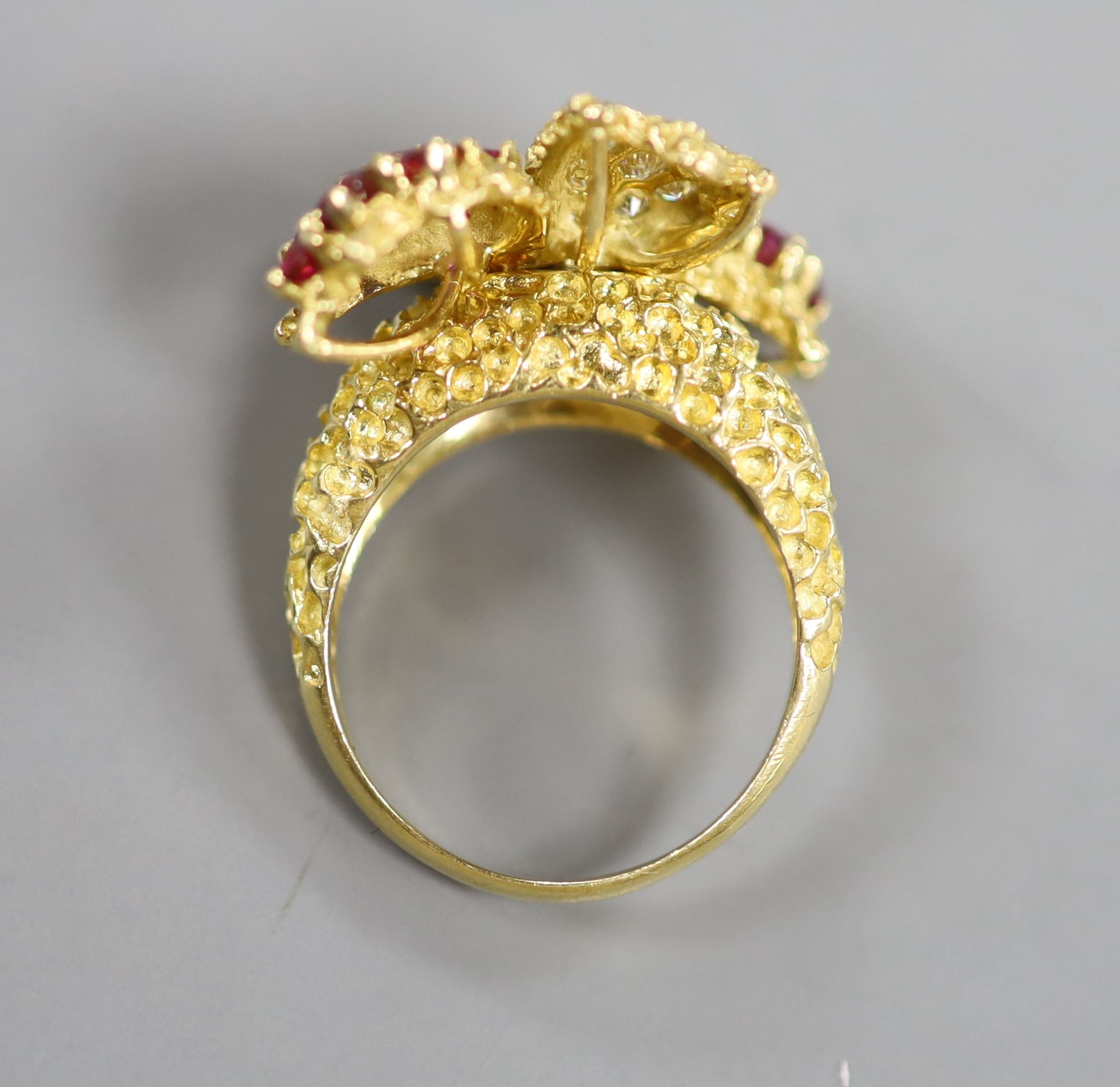 A 1970's 18ct gold, ruby and diamond quadruple cluster dress ring, by Ben Rosenfeld
